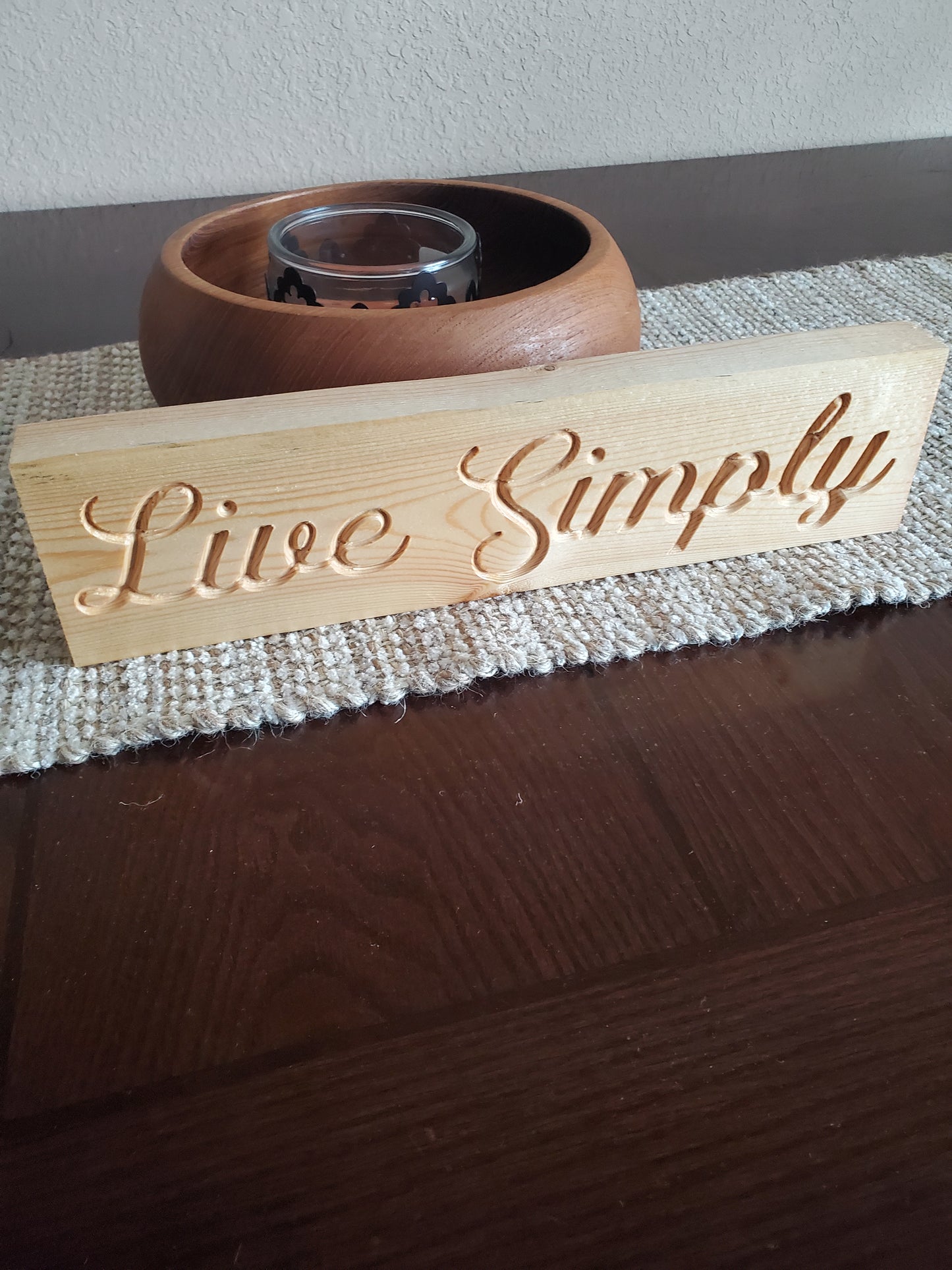 Live Simply carved sign